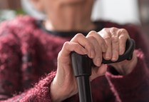 Elderly Lady Holding Stick