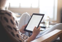 Woman Sitting On Chair Using Black Ipad 196649 (1)