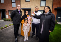 FCHO CEO Mark Gifford With OMB Council Leader Arooj Shah Handing Keys To Mr Ahmed And His Family 2